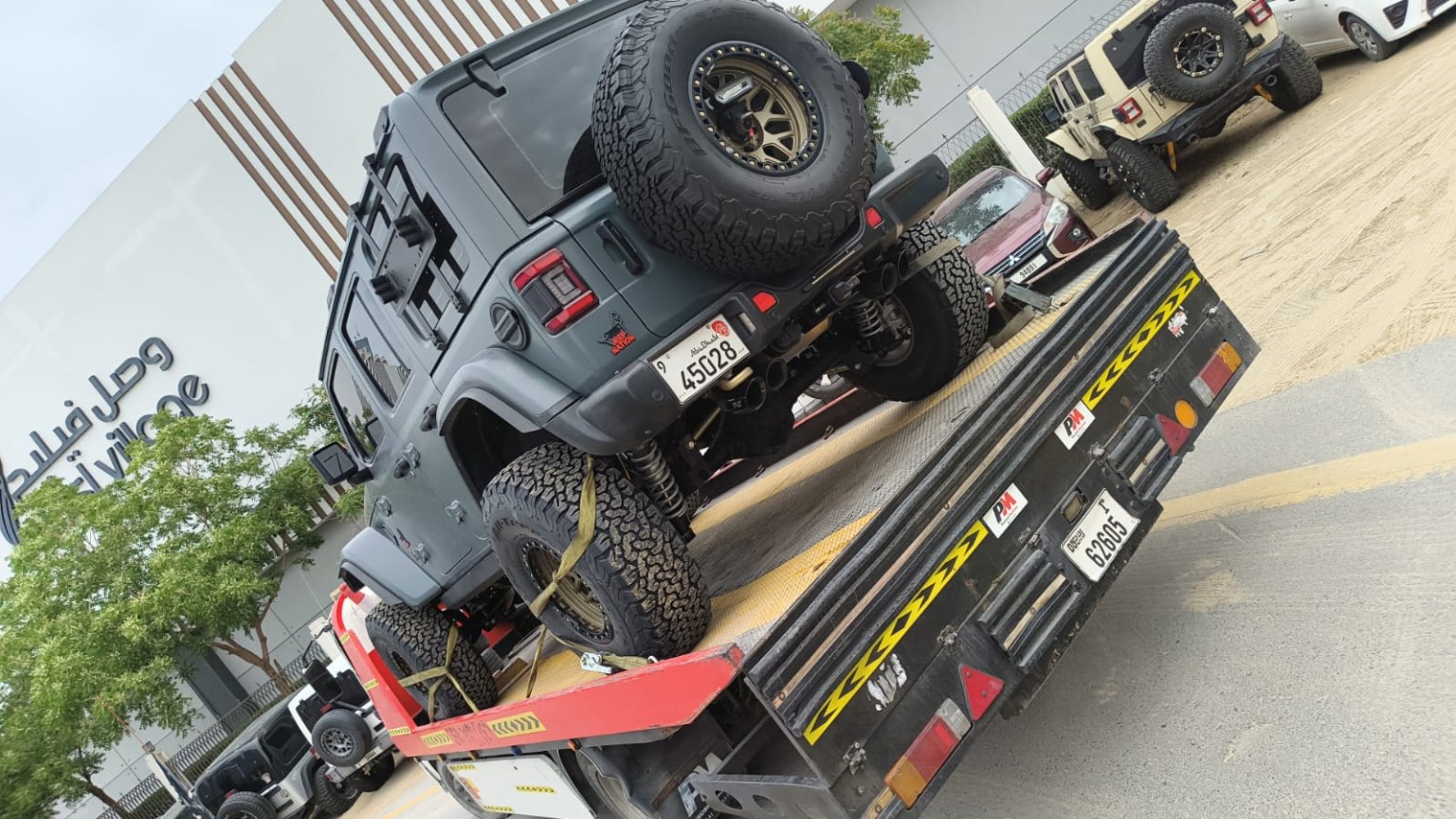 NJR Recovery Dubai tow truck with car